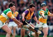 22 June 1997; Adrian Fenlon of Wexford, in action against Colm Cassidy, right, and Martin Hanamy of Offaly during the GAA Leinster Senior Hurling Championship Semi-Final match between Wexford and Offaly at Croke Park in Dublin. Photo by Ray McManus/Sportsfile