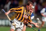 12 April 1998; Adrian Ronan of Kilkenny in action against Paul Cuddy of Laois during the National Hurling League match between Kilkenny and Laois at Nowlan Park in Kilkenny. Photo by Matt Browne/Sportsfile