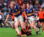 26 July 1997; Aidan Ryan of Tipperary in action against Jerome McCrickard of Down during the GAA All-Ireland Senior Hurling Championship Quarter-Final match between Tipperary and Down at St. Tiernach's Park in Clones, Monaghan. Photo by David Maher/Sportsfile