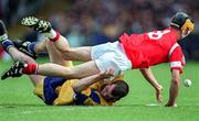 8 June 1997; Alan Cummins of Cork in action against Ollie Baker of Clare during the GAA Munster Senior Hurling Championship Semi-Final match between Clare and Cork at Gaelic Grounds, Limerick. Photo by Ray McManus/Sportsfile