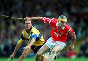 8 June 1997; Alan Cummins of Cork in action against PJ O'Connell of Clare during the GAA Munster Senior Hurling Championship Semi-Final match between Clare and Cork at the Gaelic Grounds in Limerick. Photo by Ray McManus/Sportsfile