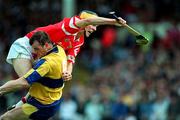 8 June 1997; Alan Cummins of Cork in action against Ollie Baker of Clare during the GAA Munster Senior Hurling Championship Semi-Final match between Clare and Cork at the Gaelic Grounds in Limerick. Photo by Ray McManus/Sportsfile