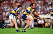 6 July 1997; Anthony Daly of Clare in action against Kevin Tucker of Tipperary during the GAA Munster Senior Hurling Championship Final match between Clare and Tipperary at Páirc Uí Chaoimh in Cork. Photo by Ray McManus/Sportsfile