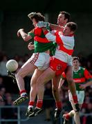 5 April 1998; Anthony Tohill of Derry in action against Pat Fallon and Liam McHale of Mayo during the National Football League Quater Final match between Mayo and Derry at Pairc Markievicz in Sligo. Photo by Ray McManus/Sportsfile