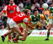 29 June 1997; Barry malone of Offaly is tackled by Colin Kelly of Louth during the Leinster GAA Senior Football Championship Semi-Final match between Offaly and Louth at Páirc Tailteann in Navan, Co Meath. Photo by Ray McManus/Sportsfile