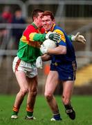 18 January 1998; Barry O'Donovan of Wicklow attempts to clear under pressure from Joe Byrne of Carlow during the Leinster GAA O'Byrne Cup Quarter-Final match between Carlow and Wicklow at at Dr Cullen Park in Carlow. Photo by Ray McManus/Sportsfile