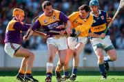 17 August 1997; Billy Byrne of Wexford, second from left, supported by team-mate Larry Murphy, left, in action against Brendan Cummins and Noel Sheehy of Tipperary during the GAA All-Ireland Senior Hurling Championship Semi-Final match between Tipperary and Wexford at Croke Park in Dublin. Photo by Ray McManus/Sportsfile