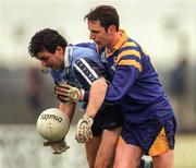 4 January 1998; Brian Barnes of Dublin is tackled by PJ O'Neill of Longford during the O'Byrne cup game at Pearse Park in Longford. Photo by Ray McManus/Sportsfile
