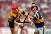 6 July 1997; Brian Lohan of Clare in action against Michael Cleary of Tipperary during the GAA Munster Senior Hurling Championship Final match between Clare and Tipperary at Páirc Uí Chaoimh in Cork. Photo by Ray McManus/Sportsfile