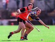 26 July 1997; Brian O'Meara of Tipperary in a tussle for possession with Kevin Coulter of Down during the GAA All-Ireland Senior Hurling Championship Quarter-Final match between Tipperary and Down at St. Tiernach's Park in Clones, Monaghan. Photo by David Maher/Sportsfile