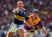 17 August 1997; Brian O'Meara of Tipperary in action against Colm Kehoe of Wexford during the GAA All-Ireland Senior Hurling Championship Semi-Final match between Tipperary and Wexford at Croke Park in Dublin. Photo by Ray McManus/Sportsfile