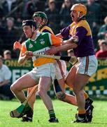 23 March 1997; Brian Whelahan of Offaly in action against Billy Byrne of Wexford during the National Hurling League Division 1 match between Offaly and Wexford at St. Brendan's Park in Birr, Offaly. Photo by David Maher/Sportsfile