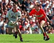 29 June 1997; Chris Lawn of Tyrone in action against Seamus Downey of Derry during the Ulster GAA Football Senior Championship Semi-Final match between Tyrone and Derry at St. Tiernach's Park in Clones, Monaghan. Photo by David Maher/Sportsfile