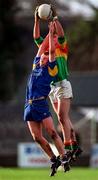 18 January 1998; Ciaran Kelly of Carlow wins possession from Conan Daye of Wicklow during the Leinster GAA O'Byrne Cup Quarter-Final match between Carlow and Wicklow at at Dr Cullen Park in Carlow. Photo by Ray McManus/Sportsfile