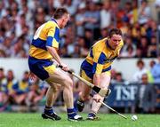10 May 1997; Colin Lynch is supported by team-mate Fergus Tuohy of Clare during the National Hurling League Division 1 match between Clare and Tipperary at Cusack Park in Ennis, Clare. Photo by Ray McManus/Sportsfile