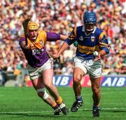17 August 1997; Colm Bonnar of Tipperary in action against Garry Laffan of Wexford during the GAA All-Ireland Senior Hurling Championship Semi-Final match between Tipperary and Wexford at Croke Park in Dublin. Photo by David Maher/Sportsfile
