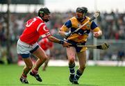 8 June 1997; Conor Clancy of Clare holds off the challenge of John O'Driscoll of Cork during the GAA Munster Senior Hurling Championship Semi-Final match between Clare and Cork at the Gaelic Grounds in Limerick. Photo by Brendan Moran/Sportsfile