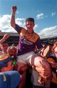 17 August 1997; Conor Gleeson the Tipperary captain celebrates this side's win following the GAA All-Ireland Senior Hurling Championship Semi-Final match between Tipperary and Wexford at Croke Park in Dublin. Photo by David Maher/Sportsfile