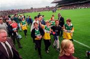 22 June 1997; Patrons of the new stand make their way along the sideline to the Hogan stand after the game was stopped by referee Pat Aherne for a few minutes during the Leinster Senior Hurling Championship Semi-Final match between Kilkenny and Dublin at Croke Park in Dublin. Photo by Ray McManus/Sportsfile