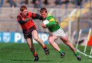 6 April 1997; Dara O'Cinneide of Kerry, gets past the challenge of Liam Howlett of Down during the National League Quarter Final at Croke Park in Dublin. Photo by Brendan Moran/Sportsfile