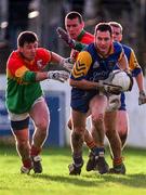 18 January 1998; David Gordan of Wicklow breaks clear from defenders Brian Farrell, left and Andrew Corden of Carlow during the Leinster GAA O'Byrne Cup Quarter-Final match between Carlow and Wicklow at at Dr Cullen Park in Carlow. Photo by Ray McManus/Sportsfile