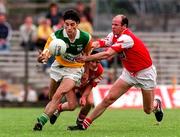 29 June 1997; David Reynolds of Offaly in action against Stephen Melia of Louth during the Leinster GAA Senior Football Championship Semi-Final match between Offaly and Louth at Páirc Tailteann in Navan, Co Meath. Photo by Ray McManus/Sportsfile