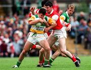 29 June 1997; David Reynolds of Offaly in action against Gerry Curran of Louth during the Leinster GAA Senior Football Championship Semi-Final match between Offaly and Louth at Páirc Tailteann in Navan, Co Meath. Photo by Ray McManus/Sportsfile