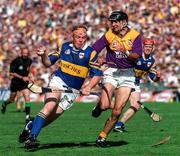 17 August 1997; Declan Ryan of Tipperary in action against John O'Connor of Wexford during the GAA All-Ireland Senior Hurling Championship Semi-Final match between Tipperary and Wexford at Croke Park in Dublin. Photo by David Maher/Sportsfile