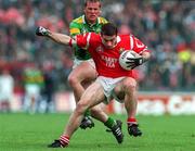 4 May 1997; Eoin Sexton of Cork in action against Dara Ó Cinnéide of Kerry during the National Football League Final match between Cork and Kerry at Páirc Uí Chaoimh in Cork. Photo by Ray McManus/Sportsfile