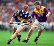 17 August 1997; Eugene O'Neill of Tipperary in action against Ger Cush of Wexford during the GAA All-Ireland Senior Hurling Championship Semi-Final match between Tipperary and Wexford at Croke Park in Dublin. Photo by Ray McManus/Sportsfile