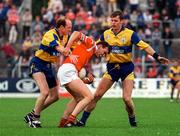 22 June 1997; Fachtna Collins of Cork in action against Donal O'Sullivan, left, with, Michael Hynes of Clare during the GAA Munster Senior Football Championship Semi-Final match between Clare and Cork at Cusack Park in Ennis, Co Clare. Photo by Damien Eagers/Sportsfile