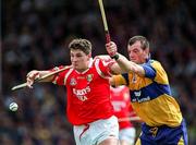 8 June 1997; Fergal McCormack of Cork in action against Ollie Baker of Clare during the GAA Munster Senior Hurling Championship Semi-Final match between Clare and Cork at the Gaelic Grounds in Limerick. Photo by Ray McManus/Sportsfile