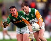 28 May 1995; Finbarr Cullen of Offaly in action against Evan Kelly of Meath during the Leinster Senior Football Championship Preliminary Round match between Meath and Offaly at Páirc Tailteann in Navan, County Meath. Photo by Ray McManus/Sportsfile