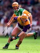 22 June 1997; Garry Laffan of Wexford in action against Ger Oakley of Offaly during the GAA Leinster Senior Hurling Championship Semi-Final match between Wexford and Offaly at Croke Park in Dublin. Photo by Ray McManus/Sportsfile
