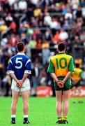 22 June 1997; Gerry Sheridan of Cavan and Adrian Sweeney of Donegal stand for the National Anthem prior to the Ulster GAA Football Senior Championship Semi-Final match between Cavan and Donegal at St Tiernach's Park in Clones, Monaghan. Photo by David Maher/Sportsfile