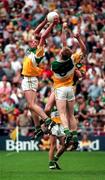 16 August 1997; James Grennan of Offaly in gets above team mate Ronan Mooney, 9, and Jimmy McGuinness of Meath during the Leinster GAA Senior Football Championship Final match between Meath and Offaly at Croke Park in Dublin. Photo by Brendan Moran/Sportsfile