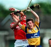 8 June 1997; James O'Connor of Clare in action against Seán Óg Ó hAilpín of Cork during the GAA Munster Senior Hurling Championship Semi-Final match between Clare and Cork at the Gaelic Grounds in Limerick. Photo by Ray McManus/Sportsfile