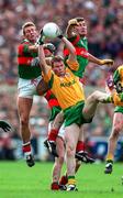 29 September 1996; Action featuring from left Colm McMenamon of Mayo, Jimmy Mc Guinness of Meath,and James Horan of Mayo  during the GAA All-Ireland Senior Football Championship Final replay match between Meath and Mayo at Croke Park in Dublin. Photo by Ray McManus/Sportsfile