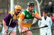 23 March 1997; Joe Errity of Offaly in action against Billy Byrne of Wexford during the National Hurling League Division 1 match between Offaly and Wexford at St. Brendan's Park in Birr, Offaly. Photo by David Maher/Sportsfile
