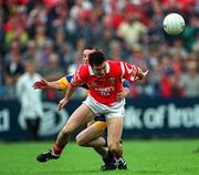 22 June 1997; Joe Kavanagh of Cork in action against Aodan McCartaigh of Clare during the GAA Munster Senior Football Championship Semi-Final match between Clare and Cork at Cusack Park in Ennis, Co Clare. Photo by Brendan Moran/Sportsfile