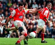 29 June 1997; John Donaldson of Louth clears upfield from Ciaran McManus of Offaly during the Leinster GAA Senior Football Championship Semi-Final match between Offaly and Louth at Páirc Tailteann in Navan, Co Meath. Photo by Ray McManus/Sportsfile