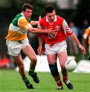 29 June 1997; John Donaldson of Louth holds off the challenge from Ciaran McManus of Offaly during the Leinster GAA Senior Football Championship Semi-Final match between Offaly and Louth at Páirc Tailteann in Navan, Co Meath. Photo by Ray McManus/Sportsfile