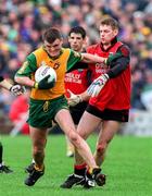 26 May 1996; John Bán Gallagher of Donagal in action against Paul Higgins and Greg Blaney of Down during the Ulster Senior Football Championship Preliminary Round at St. Tiernach's Park in Clones, Monaghan. Photo by Ray McManus/Sportsfile