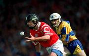 8 June 1997; John O'Driscoll of Cork in action against Ger O'Loughlin of Clare during the GAA Munster Senior Hurling Championship Semi-Final match between Clare and Cork at the Gaelic Grounds in Limerick. Photo by Ray McManus/Sportsfile