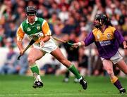 22 June 1997; Johnny Dooley of Offaly in action against Sean Flood of Wexford during the GAA Leinster Senior Hurling Championship Semi-Final match between Wexford and Offaly at Croke Park in Dublin. Photo by Ray McManus/Sportsfile