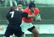 26 September 1998; Alan Quinlan of Munster is tackled by Brett Sinkinson of Neath during the Heineken Cup Pool B Round 2 match between Munster and Neath at Musgrave Park in Cork. Photo by Matt Browne/Sportsfile