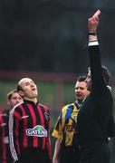 29 December 1998; Paul Doolin of Bohemians receives a red card from referee Richard O'Hanlon during the Harp Lager National League Premier Division match between Bohemians and Home Farm Everton at Dalymount Park in Dublin. Photo by David Maher/Sportsfile