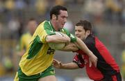 26 July 2003; Brendan Devenney, Donegal, in action against Down's Martin Cole. Bank of Ireland Senior Football Championship qualifier, Down v Donegal, St. Tighernach's Park, Clones, Co Monaghan. Picture credit; Ray McManus / SPORTSFILE *EDI*