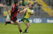 26 July 2003; Brian Roper, Donegal, in action against Down's Brendan Grant. Bank of Ireland Senior Football Championship qualifier, Down v Donegal, St. Tighernach's Park, Clones, Co Monaghan. Picture credit; Ray McManus / SPORTSFILE *EDI*