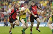 26 July 2003; Stephen McDermott, Donegal, in action against Down's Sean Ward, right, and Michael Walsh. Bank of Ireland Senior Football Championship qualifier, Down v Donegal, St. Tighernach's Park, Clones, Co Monaghan. Picture credit; Ray McManus / SPORTSFILE *EDI*
